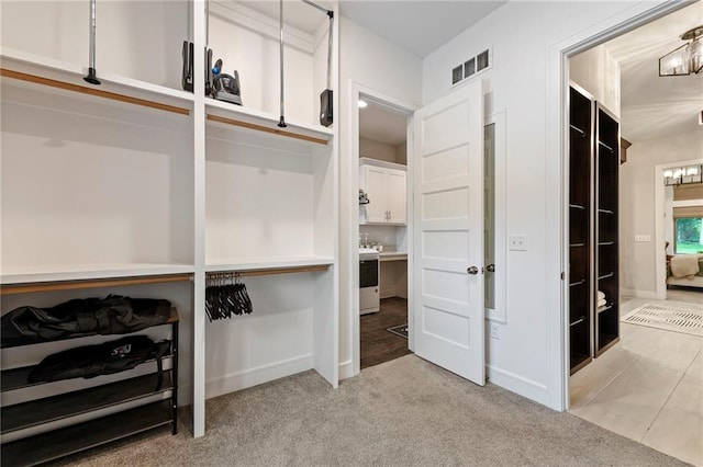 11807 S Kenton St, Olathe, KS 66061 - walk in closet with a chandelier and light colored carpet