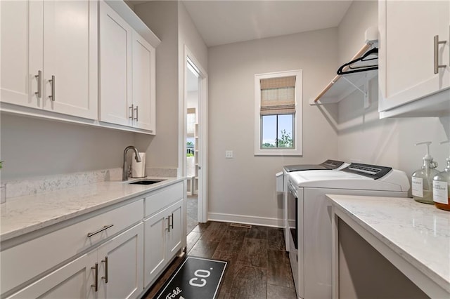 11807 S Kenton St, Olathe, KS 66061 - laundry area with independent washer and dryer, cabinet space, and dark wood-type flooring