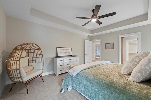 11807 S Kenton St, Olathe, KS 66061 - bedroom featuring light carpet, a raised ceiling, and a ceiling fan