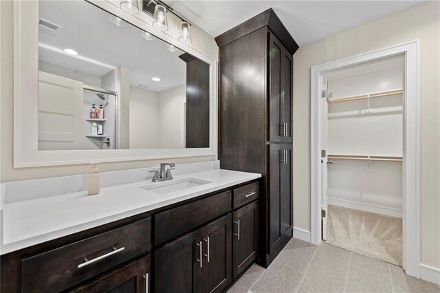 11807 S Kenton St, Olathe, KS 66061 - full bath with vanity, a spacious closet, and recessed lighting