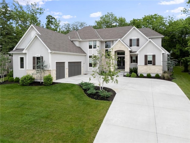 11807 S Kenton St, Olathe, KS 66061 - view of front of house featuring driveway, a garage, stucco siding, a front yard, and roof with shingles