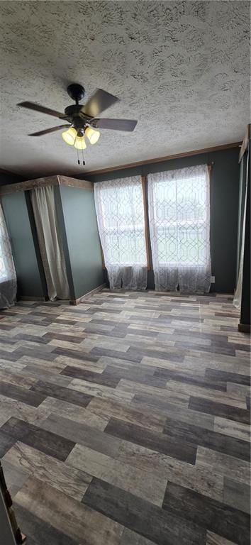 2251 Nemaha Rd, Cummings, KS 66016 - empty room with a textured ceiling and a ceiling fan