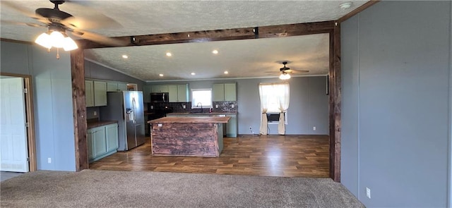 2251 Nemaha Rd, Cummings, KS 66016 - kitchen with ceiling fan, stainless steel appliances, a kitchen island, butcher block counters, and ornamental molding