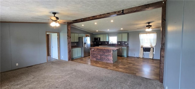 2251 Nemaha Rd, Cummings, KS 66016 - kitchen featuring ceiling fan, stainless steel appliances, dark colored carpet, butcher block countertops, and a textured ceiling