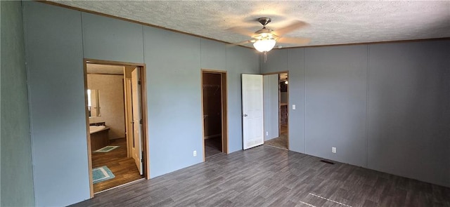 2251 Nemaha Rd, Cummings, KS 66016 - unfurnished bedroom with a textured ceiling, wood finished floors, crown molding, ensuite bath, and a closet