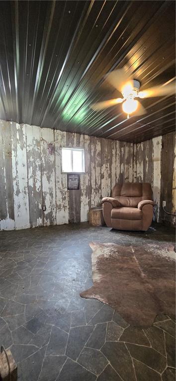 2251 Nemaha Rd, Cummings, KS 66016 - below grade area with stone finish flooring and wooden ceiling