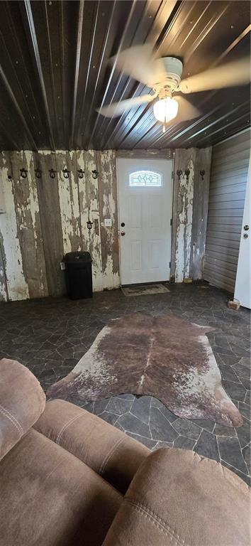 2251 Nemaha Rd, Cummings, KS 66016 - living room with stone floors and ceiling fan