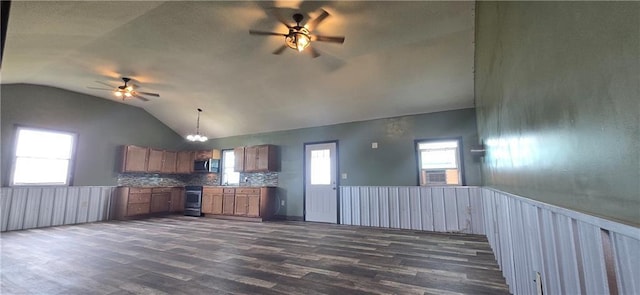 2251 Nemaha Rd, Cummings, KS 66016 - kitchen with ceiling fan, appliances with stainless steel finishes, lofted ceiling, brown cabinetry, and dark wood-type flooring