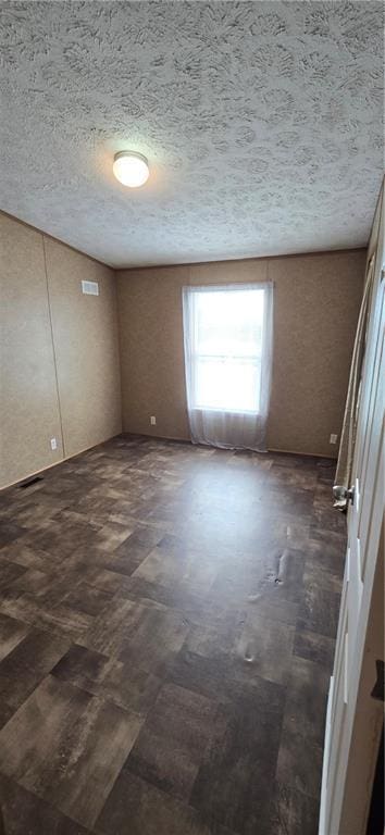 2251 Nemaha Rd, Cummings, KS 66016 - spare room with a textured ceiling