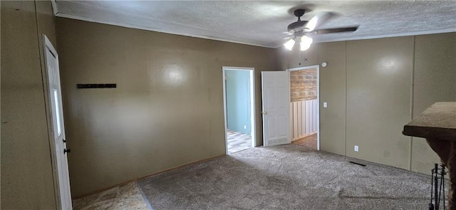 2251 Nemaha Rd, Cummings, KS 66016 - unfurnished bedroom with carpet, a textured ceiling, crown molding, and a ceiling fan