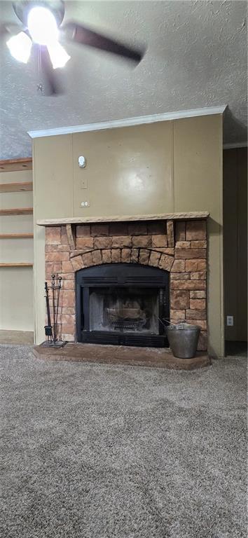 2251 Nemaha Rd, Cummings, KS 66016 - detailed view of a stone fireplace, carpet floors, ornamental molding, ceiling fan, and a textured ceiling