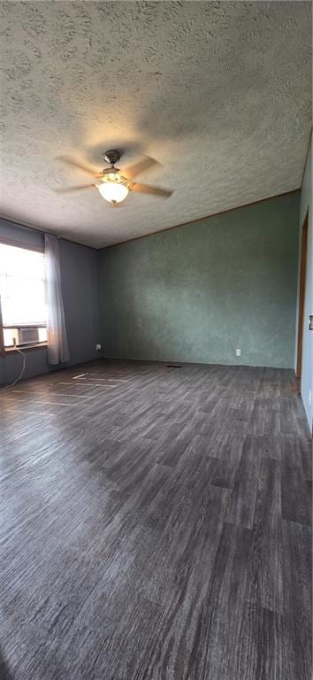2251 Nemaha Rd, Cummings, KS 66016 - empty room with a textured ceiling, dark wood finished floors, and ceiling fan