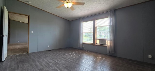 2251 Nemaha Rd, Cummings, KS 66016 - spare room featuring vaulted ceiling, a textured ceiling, a ceiling fan, wood finished floors, and cooling unit