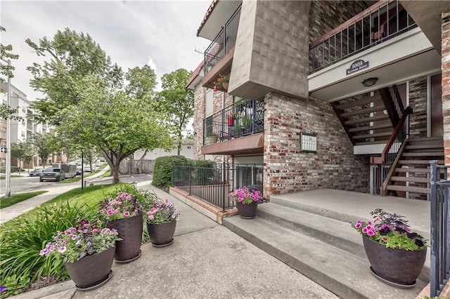 5008 Baltimore Ave Unit 102, Kansas City, MO 64112 - view of building exterior with stairway