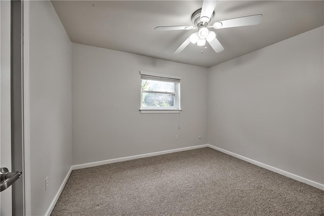 5008 Baltimore Ave Unit 102, Kansas City, MO 64112 - carpeted spare room featuring baseboards and a ceiling fan