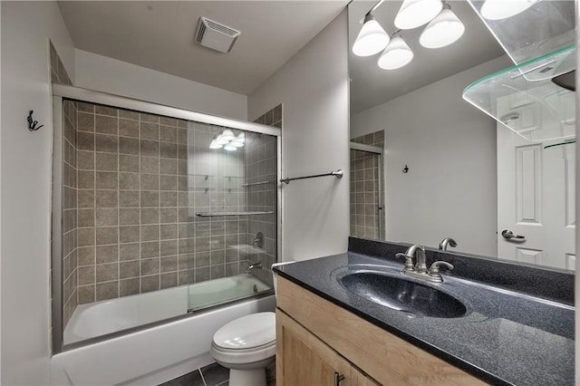 5008 Baltimore Ave Unit 102, Kansas City, MO 64112 - bathroom featuring vanity, shower / bath combination with glass door, and tile patterned floors