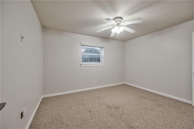 5008 Baltimore Ave Unit 102, Kansas City, MO 64112 - carpeted spare room with ceiling fan and baseboards