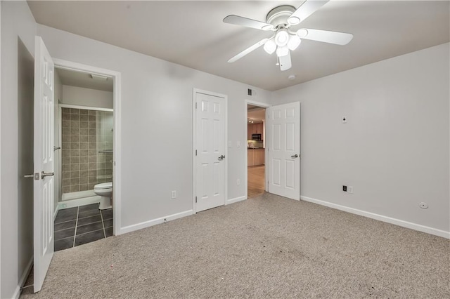 5008 Baltimore Ave Unit 102, Kansas City, MO 64112 - unfurnished bedroom featuring carpet floors, ensuite bathroom, and a ceiling fan