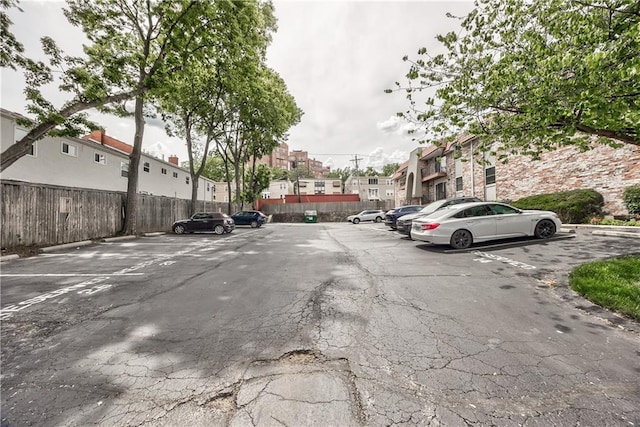 5008 Baltimore Ave Unit 102, Kansas City, MO 64112 - uncovered parking lot with a residential view