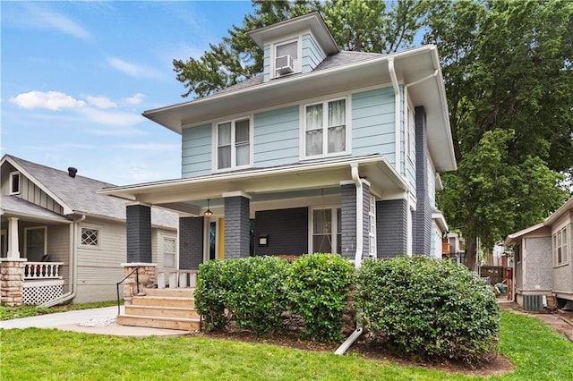 111 E Ruby Ave, Independence, MO 64050 - american foursquare style home with a porch and a front yard