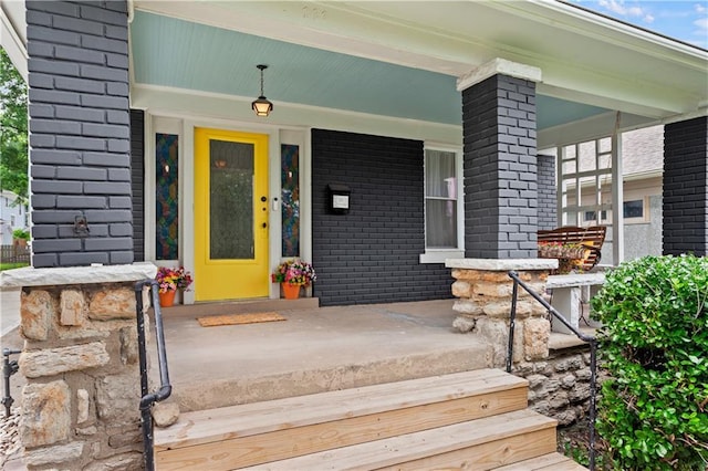 111 E Ruby Ave, Independence, MO 64050 - property entrance with covered porch and brick siding