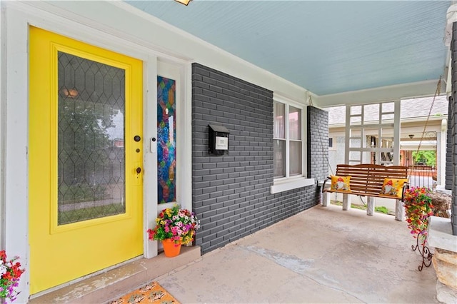 111 E Ruby Ave, Independence, MO 64050 - entrance to property with covered porch and brick siding