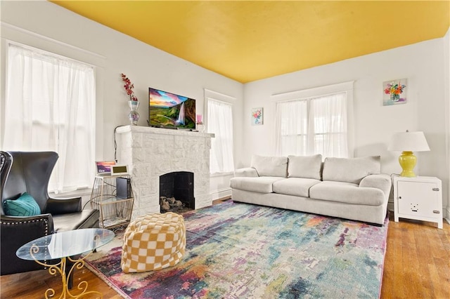 111 E Ruby Ave, Independence, MO 64050 - living area with wood finished floors and a stone fireplace