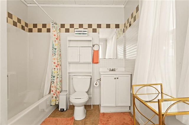 111 E Ruby Ave, Independence, MO 64050 - bathroom with vanity, tile patterned floors, shower / bath combo with shower curtain, and tile walls
