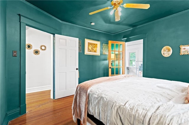 111 E Ruby Ave, Independence, MO 64050 - bedroom featuring wood finished floors, crown molding, and ceiling fan