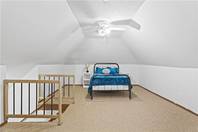 111 E Ruby Ave, Independence, MO 64050 - carpeted bedroom with vaulted ceiling, a ceiling fan, and a textured ceiling