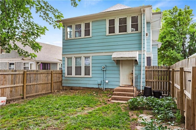 111 E Ruby Ave, Independence, MO 64050 - rear view of house featuring a fenced backyard