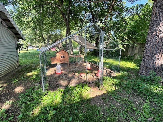 110 W 7th St, Knob Noster, MO 65336 - view of yard with exterior structure and an outdoor structure