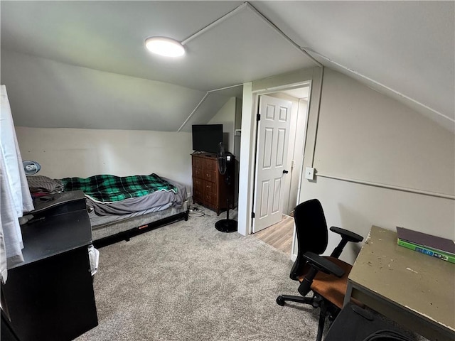 110 W 7th St, Knob Noster, MO 65336 - bedroom with lofted ceiling, carpet floors, and a desk