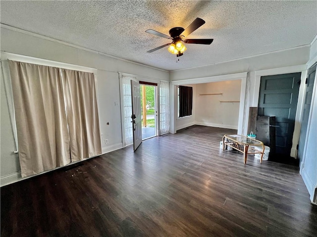 522 S 2nd St, Independence, KS 67301 - unfurnished living room with a textured ceiling, wood finished floors, and a ceiling fan