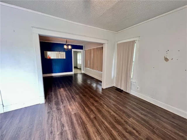 522 S 2nd St, Independence, KS 67301 - unfurnished room with a chandelier, wood finished floors, and a textured ceiling