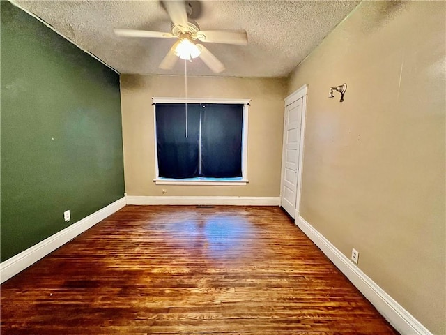 522 S 2nd St, Independence, KS 67301 - empty room featuring a textured ceiling, wood finished floors, and a ceiling fan