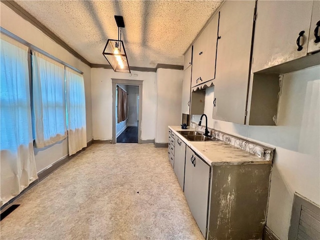 522 S 2nd St, Independence, KS 67301 - kitchen with crown molding, light carpet, light countertops, and pendant lighting