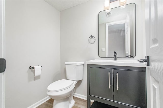 4612 Whispering Winds Dr Unit B, Lees Summit, MO 64064 - half bath featuring wood finished floors, vanity, and a textured ceiling