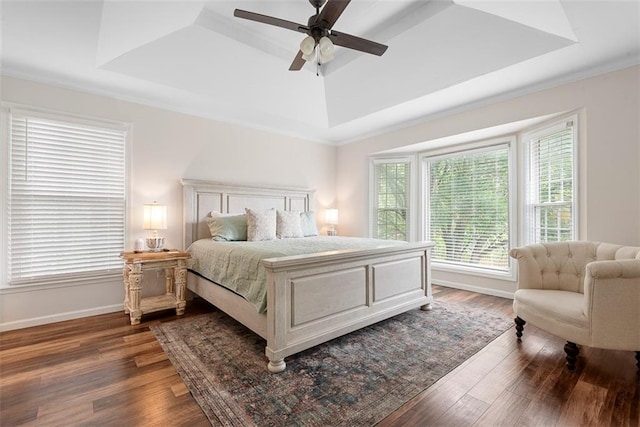 2433 Post Oak Rd, Olathe, KS 66061 - bedroom with a tray ceiling, dark wood-style flooring, a ceiling fan, and crown molding