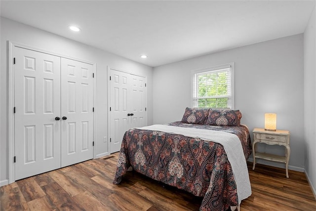 2433 Post Oak Rd, Olathe, KS 66061 - bedroom featuring multiple closets, wood finished floors, and recessed lighting
