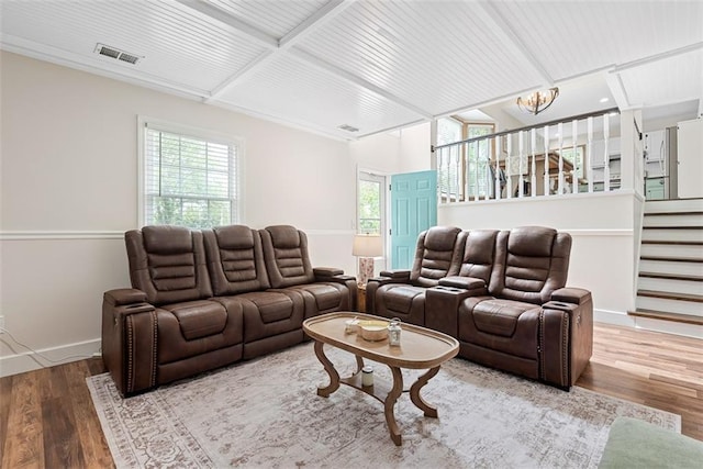 2433 Post Oak Rd, Olathe, KS 66061 - living area with plenty of natural light, a chandelier, wood finished floors, stairway, and beam ceiling