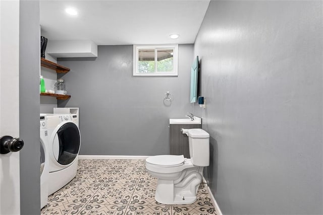 2433 Post Oak Rd, Olathe, KS 66061 - bathroom featuring washer / dryer and recessed lighting
