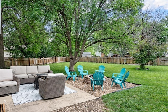 2433 Post Oak Rd, Olathe, KS 66061 - fenced backyard with an outdoor living space with a fire pit and a patio