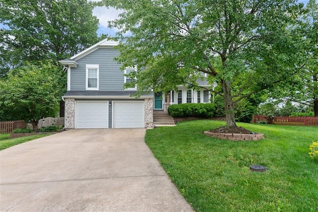 2433 Post Oak Rd, Olathe, KS 66061 - view of front facade featuring concrete driveway, a garage, and stone siding