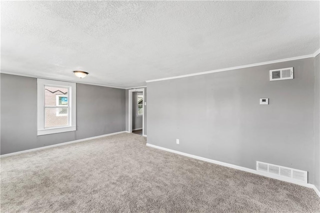 1202 E 23rd St S, Independence, MO 64055 - spare room with a textured ceiling, carpet, and ornamental molding