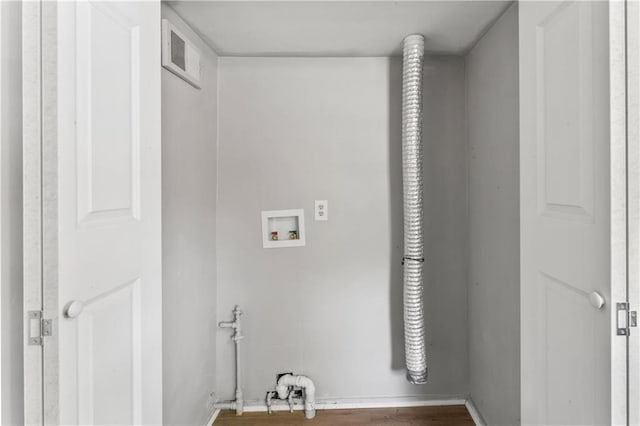1202 E 23rd St S, Independence, MO 64055 - laundry area with washer hookup, electric dryer hookup, and wood finished floors