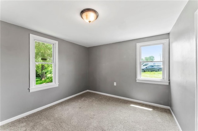 1202 E 23rd St S, Independence, MO 64055 - carpeted empty room with plenty of natural light