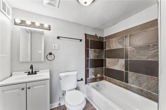 1202 E 23rd St S, Independence, MO 64055 - bathroom with a textured ceiling, vanity, shower / bath combination, and wood finished floors