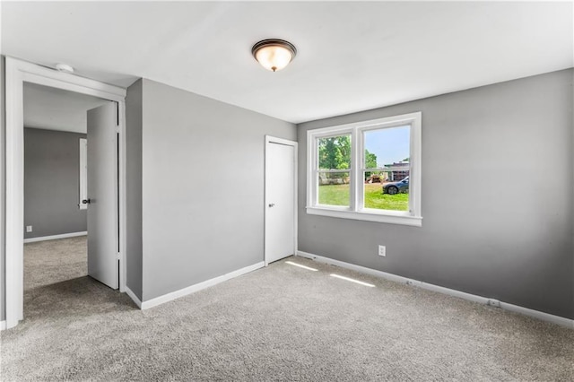 1202 E 23rd St S, Independence, MO 64055 - unfurnished bedroom with carpet flooring and a closet