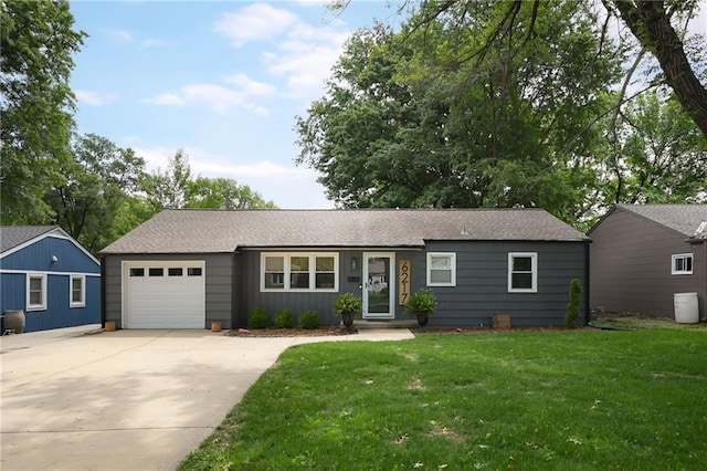 6217 Glenwood St, Mission, KS 66202 - ranch-style home featuring an attached garage, concrete driveway, a front lawn, and a shingled roof